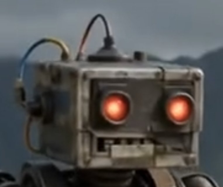 Close-up of a BroBot head with glowing red eyes